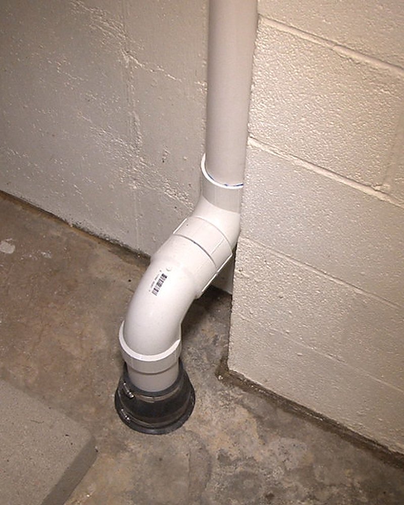 Interior radon suction point piped through a Lancaster County basement slab
